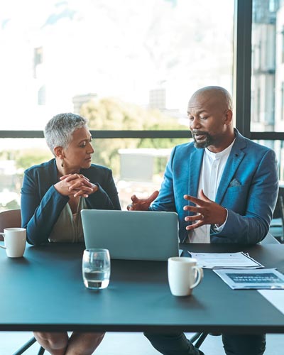 two lawyers discussing at conference table